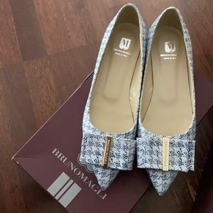 Never worn Bruno Magli flats. Fit smaller then a 10.